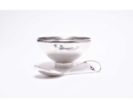 A Georg Jensen silver bowl and spoon, the lightly planished circular bowl raised on collet foot, the base stamped 'Georg Jens