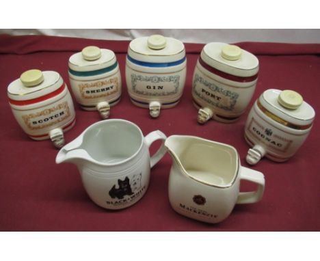 HCW Black and White whisky water jug, Wade Mackenzie  jug and a five Wade miniature Spirit barrels (7) 
