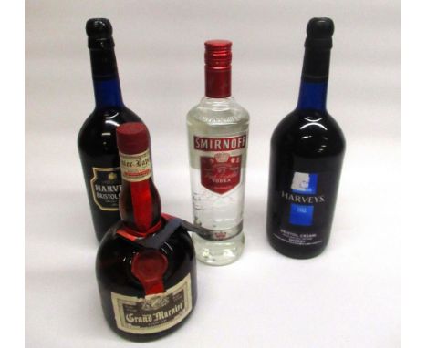 Two 1ltr bottles of Harvey's Bristol Cream sherry, 70cl bottle of Smirnoff no.21 triple distilled vodka, 70cl bottle of Grand