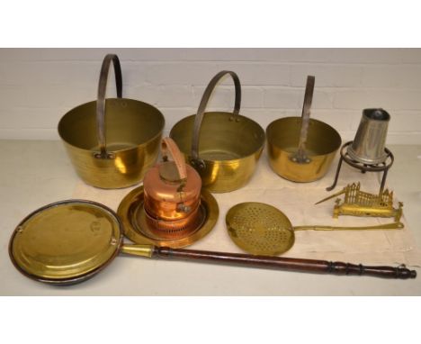 Collection of brass and copper ware including bedwarming pan, three copper jam pans in various sizes, trivet and ISC Round Is