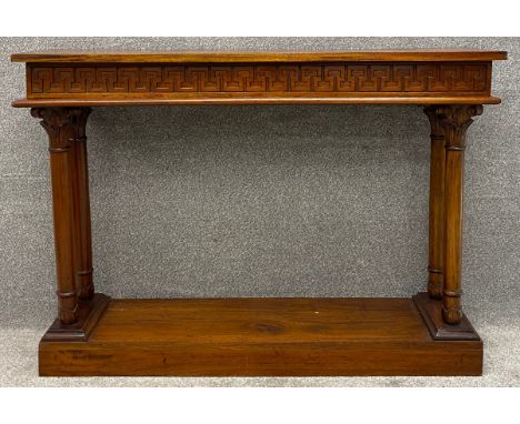 A contemporary teak console table with classical motifs. H.90 W.129 D.33cm
