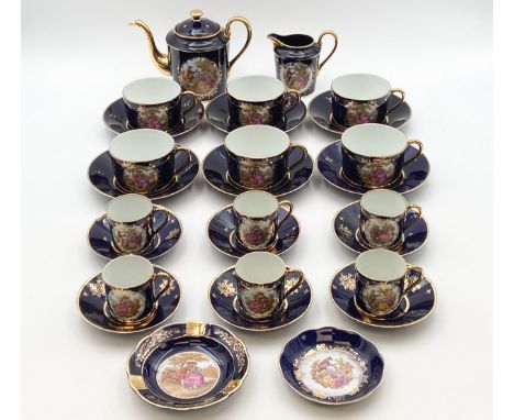 A Limoges porcelain tea and coffee service comprising six coffee cans with saucers, six tea cups with saucers, a teapot, crea