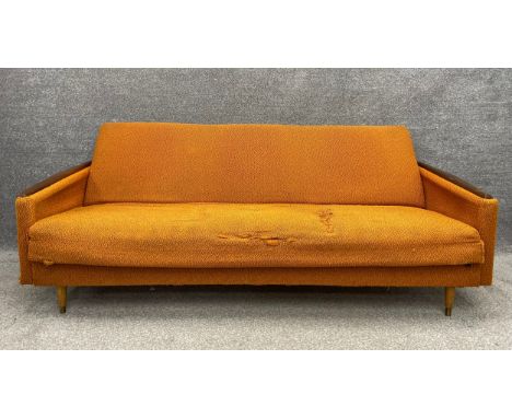 A mid century Danish style daybed with teak armrests and tapering feet, with original orange wool upholstery. H.76 W.203 D.75