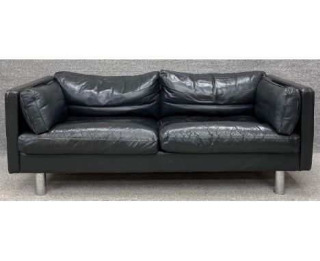 A mid century Danish Erik Jorgensen two seater sofa in black leather upholstery. H.64 W.178 D.87cm.
