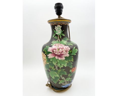 A Chinese cloisonne vase lamp with a blossom design on a black ground, with labels to the base.  H.48cm.