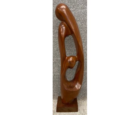 A mid century carved teak abstract figural figure group sculpture.. H.76cm.