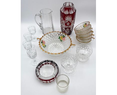 A collection of vintage cut glass to include a Bohemian vase and ashtray, the ashtray having an etched Skoda symbol, and a de