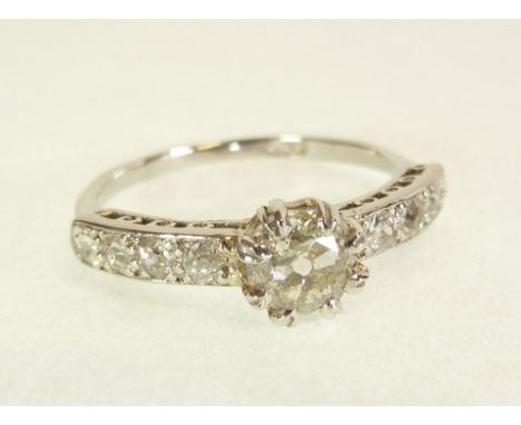 PLATINUM SOLITAIRE DIAMOND RING, eight claw set old cut diamond 0.46ct approx., galleried shoulders each set with four pave s