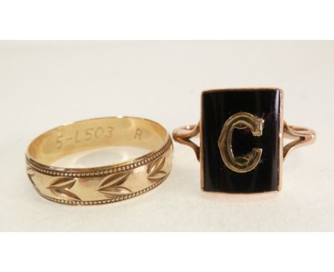 9CT GOLD RING, WITH BEZEL SET RECTANGULAR BLACK ONYX, WITH APPLIED GOLD 'C', Chester 1930, 2.6g AND A 9CT GOLD ENGRAVED WEDDI