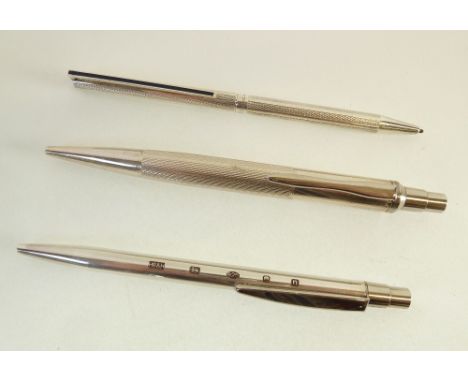 TWO HALLMARKED SILVER BALLPOINT PENS by Harrison Borthers and Howson Ltd., London 2011 and 2013 and a DUPONT, PARIS ENGINE TU