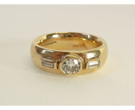 GENT'S 9CT GOLD THREE STONE DIAMOND RING, bezel set with an old cut diamond, 0.50ct approx., flanked by two bezel set baguett