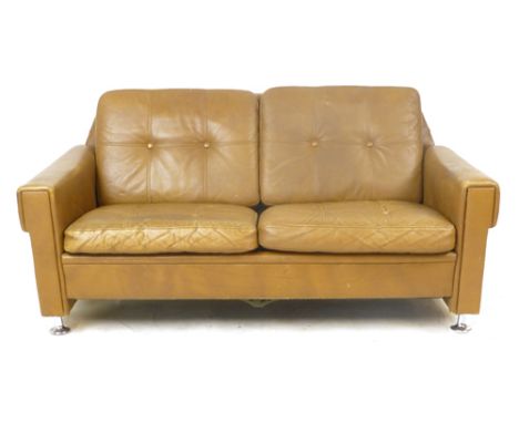 A Skippers Mobler tan leather and button upholstered two seater sofa on chromed feet CONDITION REPORT: The auctioneers are ha