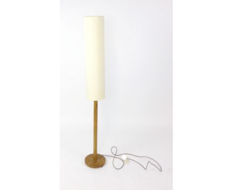 A 1970's beech turned standard lamp with a tall shade CONDITION REPORT: Shade damaged, working order not guaranteed, may requ