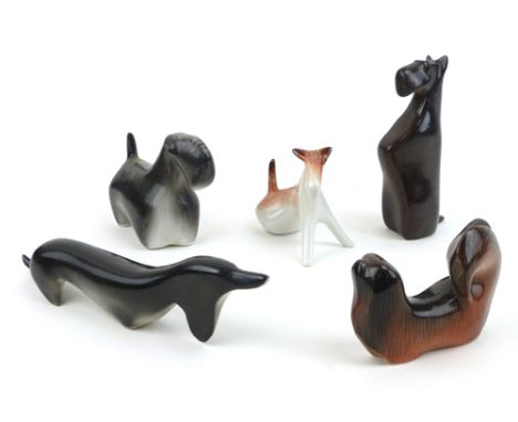 A set of five Polish ceramic ornaments modelled as stylised dogs CONDITION REPORT: No obvious chips, cracks or restoration
