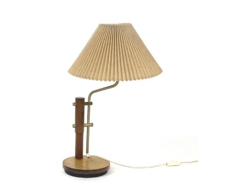 A 1970's turned beech table lamp with a stainless steel bent and adjustable shaft on a circular base  CONDITION REPORT: Worki