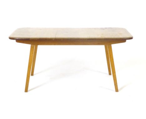 An Ercol-type beech coffee table of rectangular form on square tapering legs, l. 85 cm CONDITION REPORT: Water marks and wear