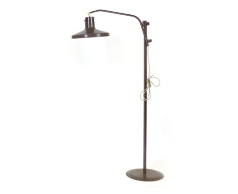 A 1970's brown standard lamp, the overhanging shade on a bent square shaft  CONDITION REPORT: Working order unknown, losses a
