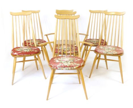 A set of six Ercol elm and beech spindle back dining chairs, including two carvers CONDITION REPORT: Structurally sound, some