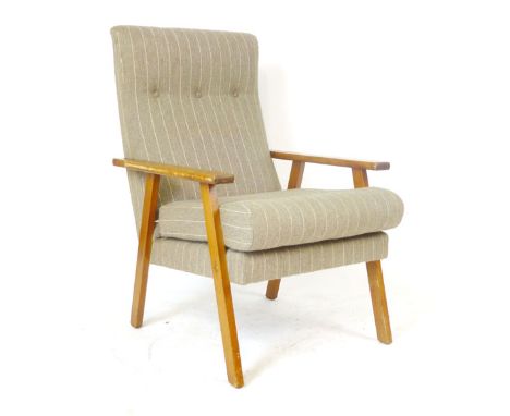 A pair of 1970's button upholstered lounge armchairs on square straight legs CONDITION REPORT: Wear commensurate with age and