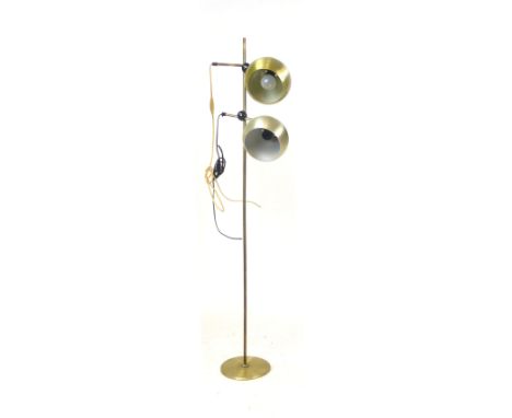 A 1970's standard lamp, the two brass coloured spherical shades on a straight shaft CONDITION REPORT: Working order unknown, 