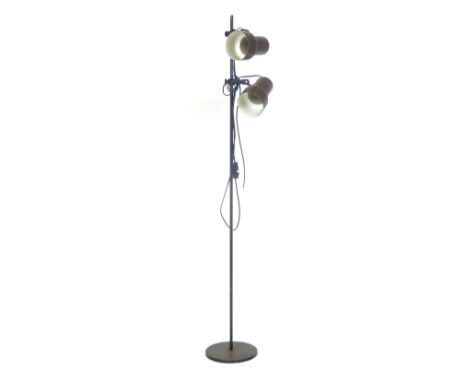 A 1970's brown enamelled twin spot standard lamp on a straight shaft CONDITION REPORT: Working order unknown, losses and pitt