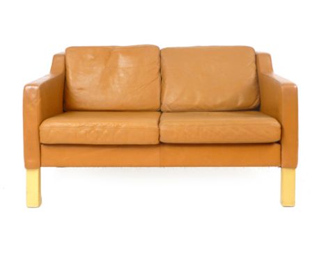 A 1970's tan leather two seater sofa on beech square straight feet CONDITION REPORT: Wear commensurate with age and use