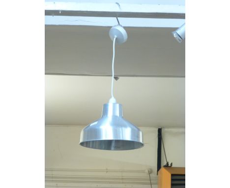An aluminium ceiling light of squat form