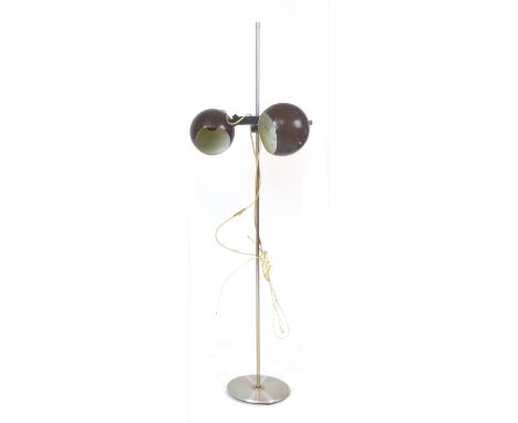 A 1970's standard lamp, the two brown adjustable spherical shades on a straight shaft CONDITION REPORT: Working order unknown