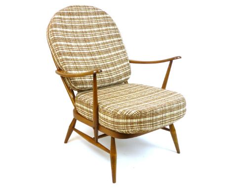 An Ercol 'Golden Dawn' beech framed lounge armchair with loose cushions CONDITION REPORT: Good for age, structurallly sound