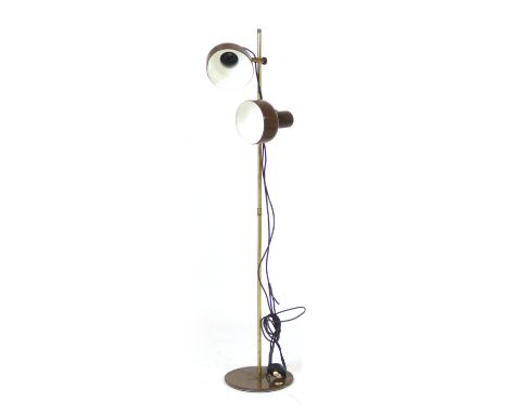 A 1970's standard lamp, the two brown enamelled shades on a straight shaft CONDITION REPORT: Working order unknown, losses an