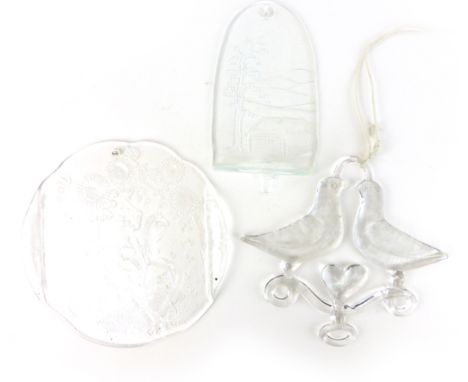 A Boda clear glass wall plaque, relief moulded with a stylised knight in a fantasy world, h. 27 cm, together with a similar t