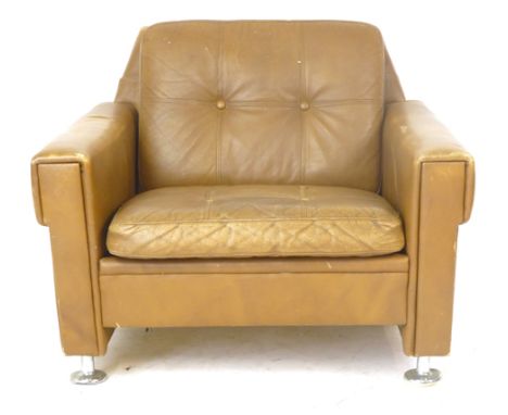 A Skippers Mobler tan leather and button upholstered lounge armchair on chromed feet CONDITION REPORT: Wear commensurate with