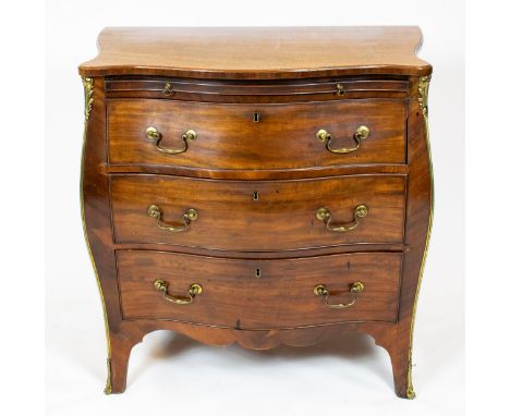 BOMBE COMMODE, George III mahogany, circa 1770, with a brushing slide over three drawers with gilt metal mounts, 87cm W x 53c