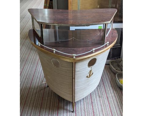 COCKTAIL BAR, in the form of a ships prow, vintage 20th century light up interior to top, 100cm x 75cm x 104cm. 