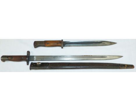 A 1907 pattern British Bayonet August 1916 by Capman, original scabbard and a German Mauser bayonet 