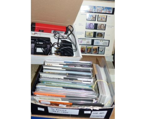  GB stamps including green ring binder, 70 presentation packs 1965 - 75 and an SG de-luxe ultra-violet lamp