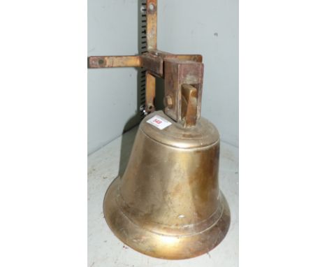 A large brass ship's bell on steel wall bracket height 10''