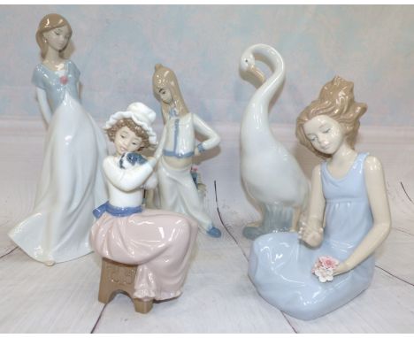 A Nao figure of a Swan, a Nao seated girl, another Nao figure, two similar Spanish figures