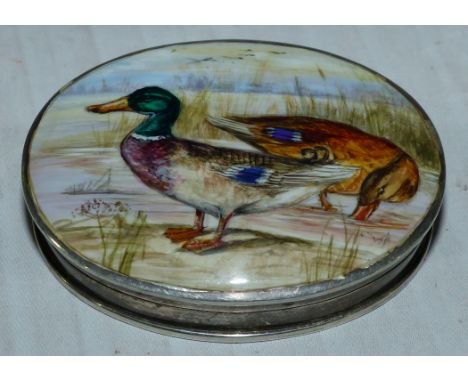 A silver oval patch box with hand enameled top depicting ducks