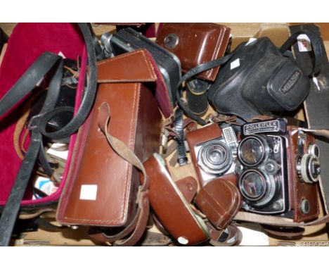 A pair of vintage field glasses Taylor and Hobson, vintage Rolleiflex camera, vintage Voightlander and other camera equipment