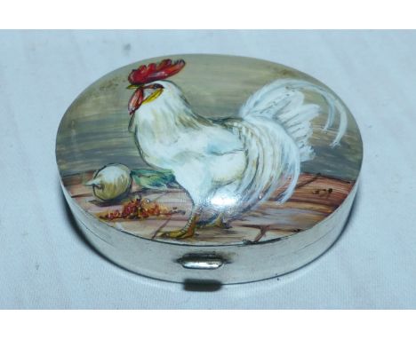 A silver oval patch box with hand enameled top depicting a Cockerel 