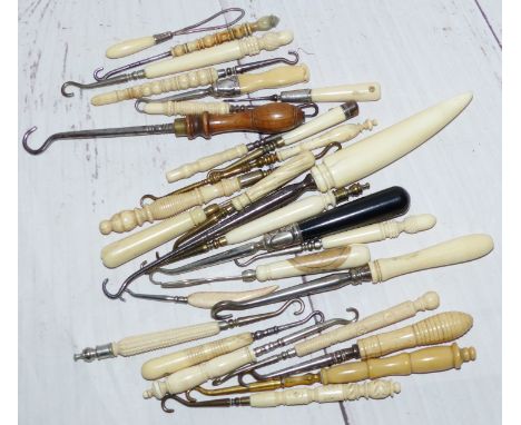 A collection of 28 19th Century bone and Ivory handled button hooks