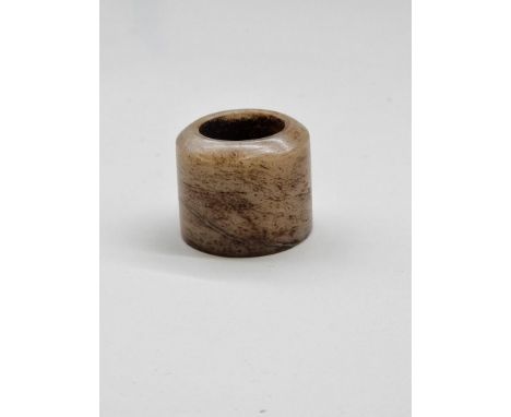 A Chinese mottled green jade archer's ring,&nbsp;probably Qing, 3cm long. 