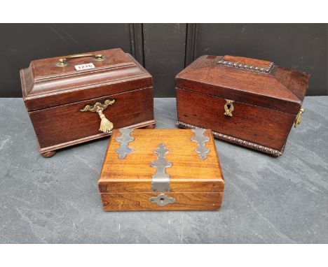 A George III mahogany tea caddy,&nbsp;22cm wide; together with another 19th century example; and a small elm casket (3) 