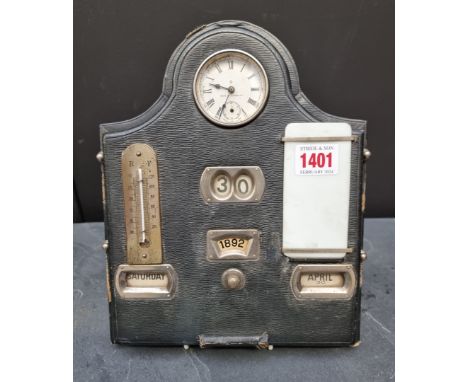 A late 19th century leather desk calendar, incorporating a clock and thermometer, 21.5cm wide. 