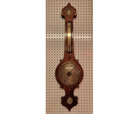 A 19th century rosewood four dial banjo barometer,&nbsp;inscribed 'Gilhooly, Hulme, Manchester' 
