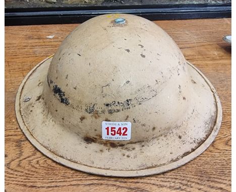 A British WWII 8th Army 'Desert Rats' steel helmet, stamped 'Jaeger Rand'.