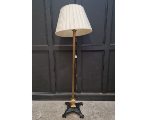 A brass and cast iron Corinthian column standard lamp,&nbsp;height excluding fitting 158cm. 