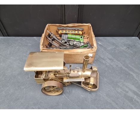 A brass live steam traction engine;&nbsp;together with a small quantity of Hornby O gauge. 