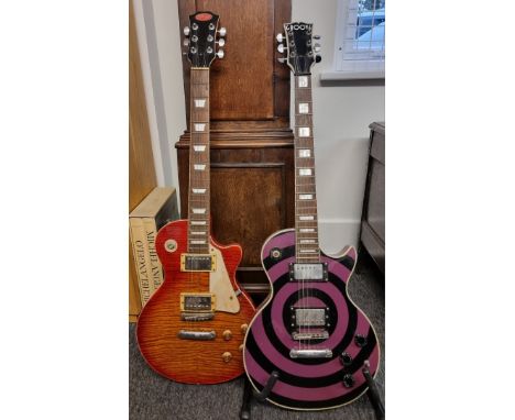 A&nbsp;cherry red sunburst 'Les Paul' style electric guitar, by Stagg; together with another electric guitar, by Groove. (2) 